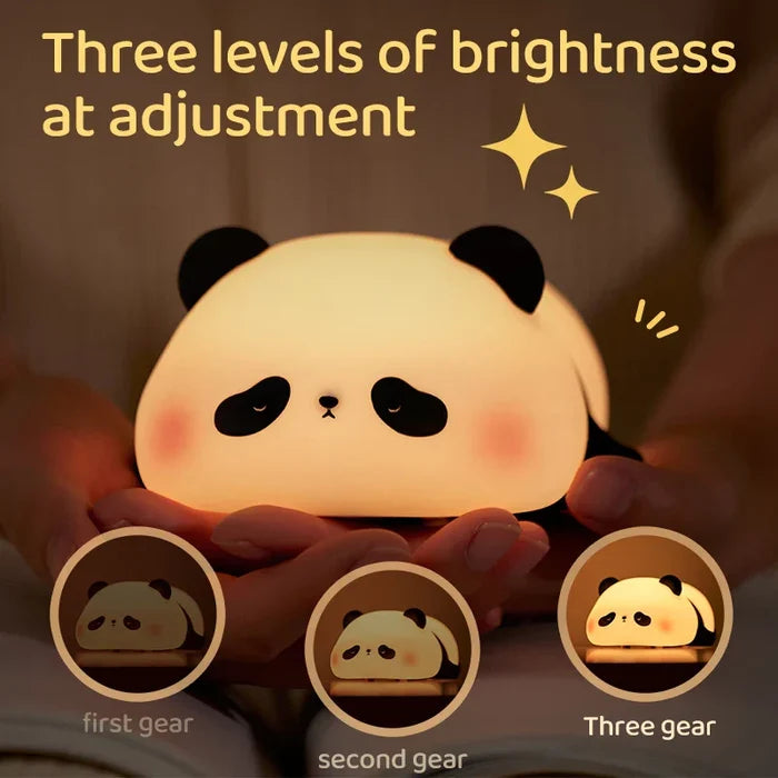 Panda LED night light held in hands, soft warm glow and smiling face
