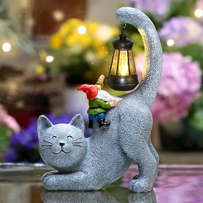 Gray cat garden statue with solar lantern and small gnome figurine, textured finish