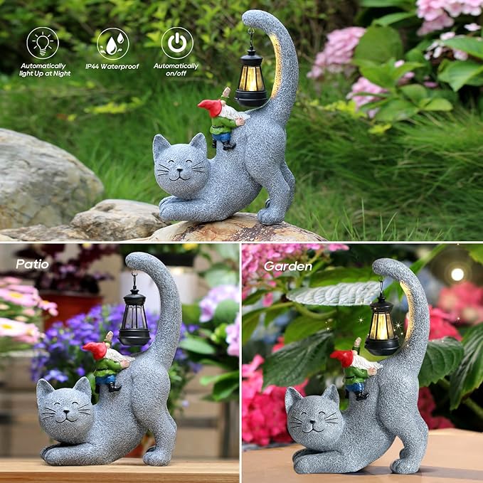 Gray cat statue holding a solar lantern, small gnome on its shoulder, outdoor decor