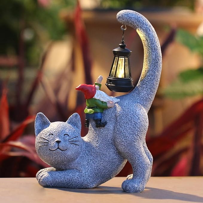 Gray cat garden statue side view with hanging solar lantern and gnome figurine
