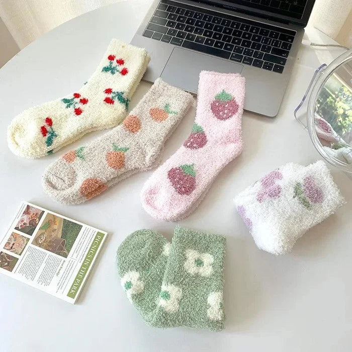 Plush sleeping socks assortment with fruit prints in cream, pink, and green colors