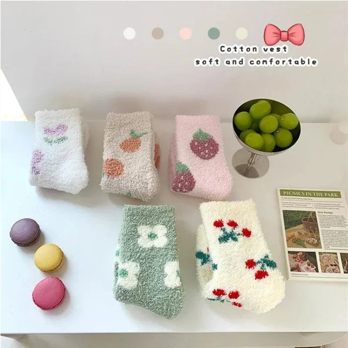 Soft plush sleeping socks set with pastel fruit designs in pink, cream, and green