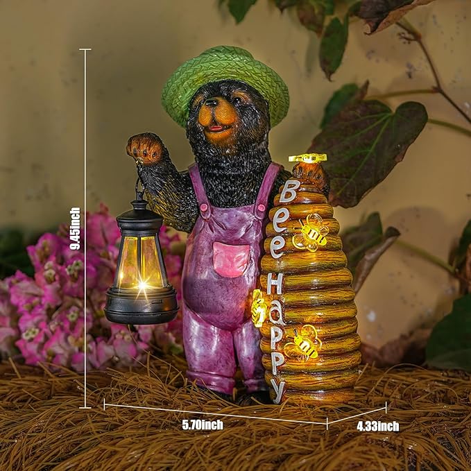 Solar bear statue with green hat, lantern, and beehive, shown with size measurement lines.