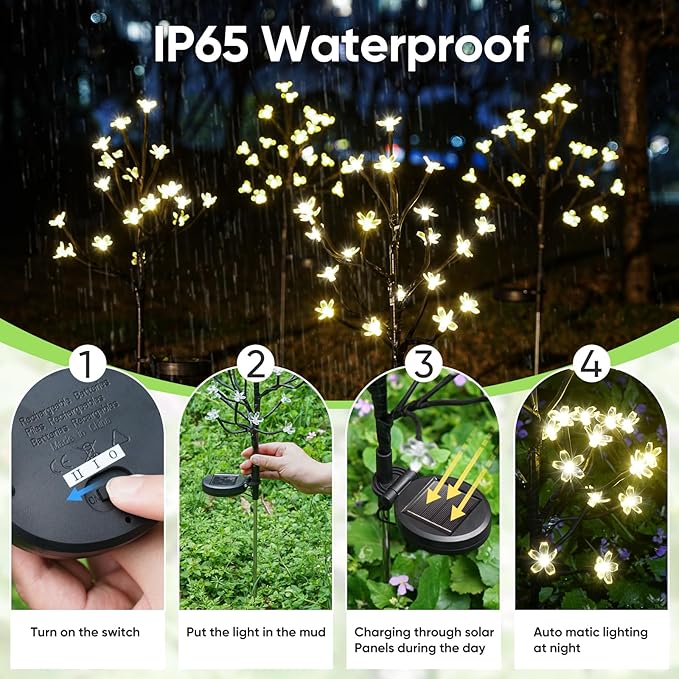 Solar flower LED garden lights on tall black stakes, glowing white flower heads