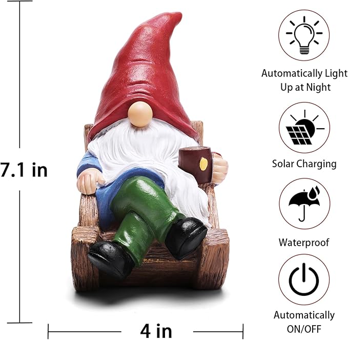 Solar garden gnome statue in wooden sled with lantern, red hat, white beard, green pants