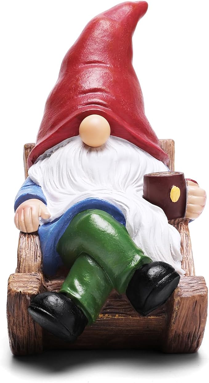 Solar garden gnome figurine on wooden sled holding lantern, red pointed hat and green pants