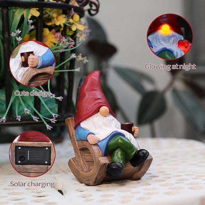 Solar-powered garden gnome on wooden sled holding lantern, red hat, white beard, green pants