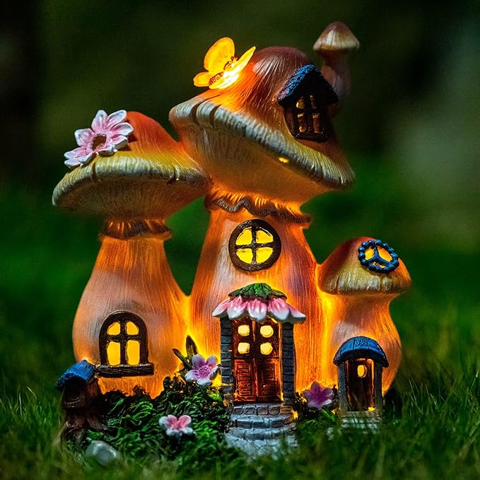 Illuminated fairy house garden statue with mushroom roof, glowing windows and flowers, moss base