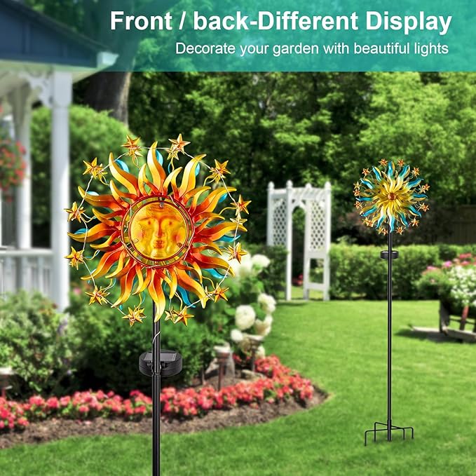 Garden solar sun wind spinner sculpture with LED glow on a tall black stake