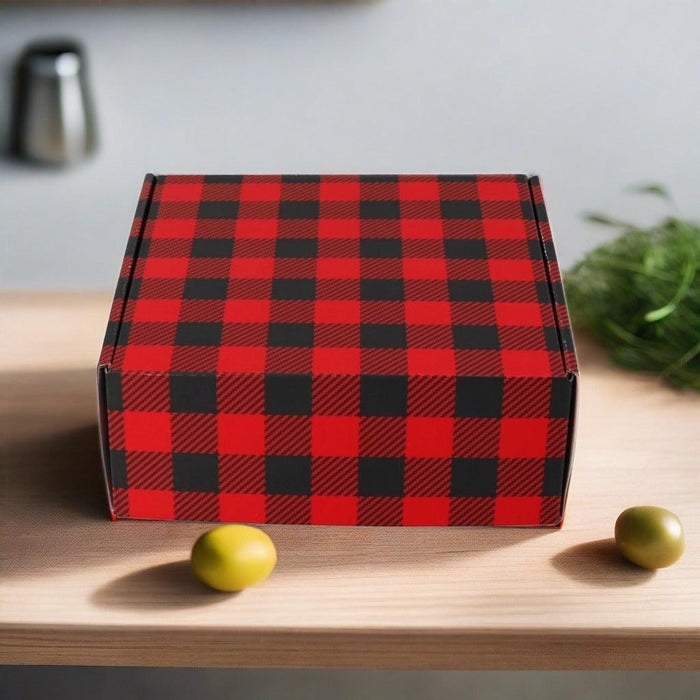 Buffalo check gift box in red and black on a table