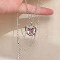 Heart crystal pendant necklace with pink heart stone, silver chain and star side details