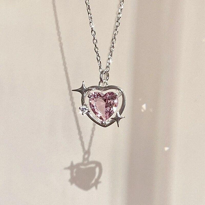 Heart crystal pendant necklace, pink heart stone set in silver with star-shaped prongs