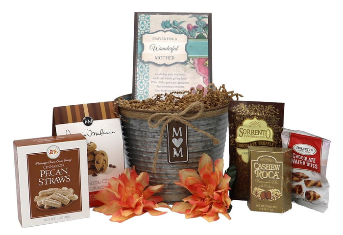Mom gift tin basket with "M M" tag, orange flowers, and assorted snack tins