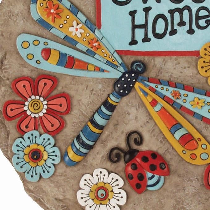 Round resin stepping stone close-up with dragonfly, ladybug, and “Home Sweet Home” text