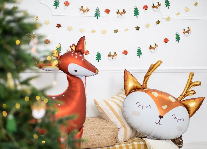 Red deer balloon with white muzzle and antlers beside a foil fox balloon