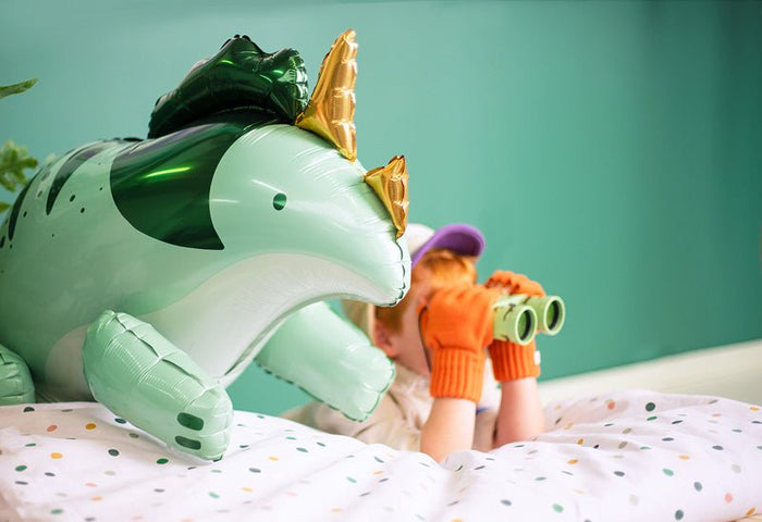 Standing triceratops foil balloon side view in light green with dark green stripes
