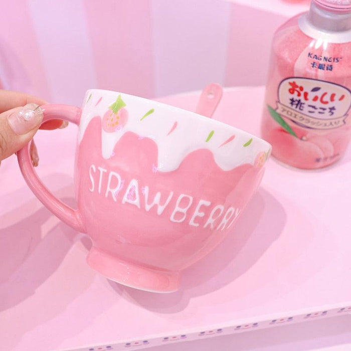 Strawberry milk mug with pink handle, drip graphic, and strawberry print