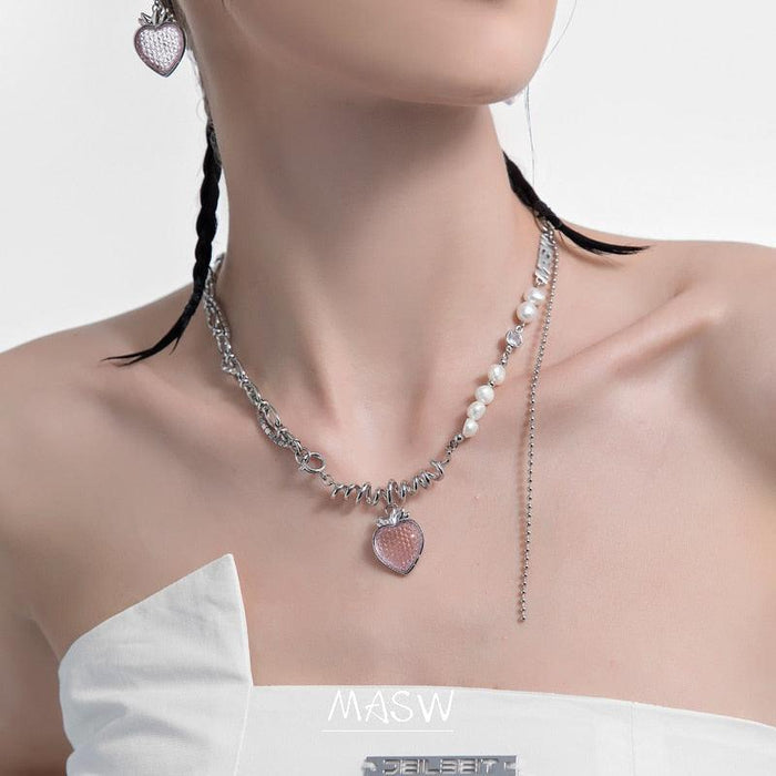 Silver-tone necklace with pink strawberry-heart pendant and pearl accents, layered chain