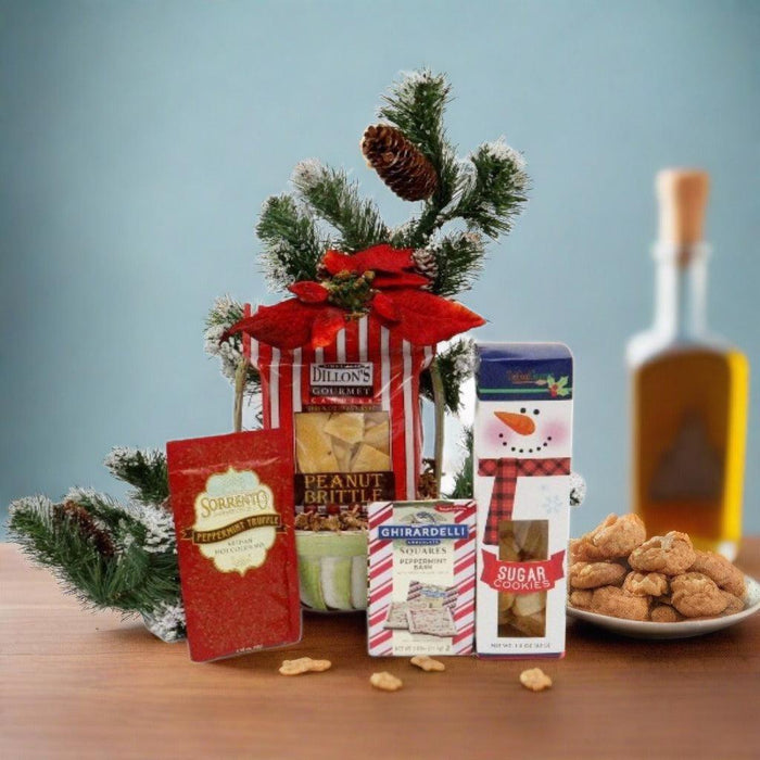Holiday gift basket with pine sprigs and wrapped treats, plus a bowl of cookies