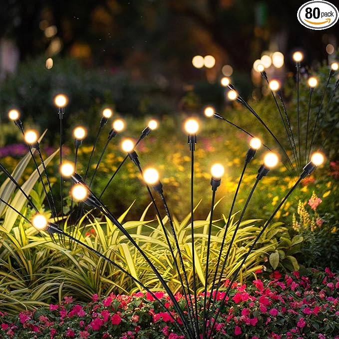 Solar outdoor swing lights with warm white bulbs on flexible black garden poles