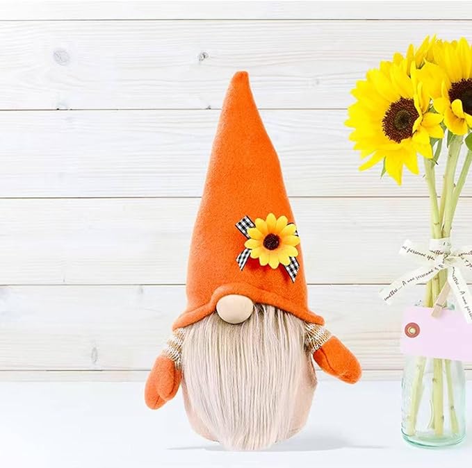 Orange-and-white plush gnome decor with sunflower accent and plaid bow on hat