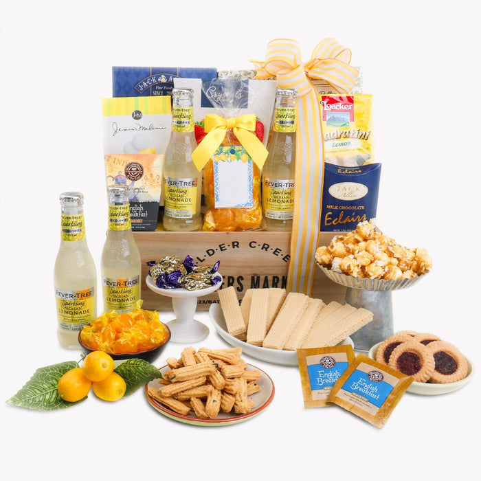 Summer gift basket with bottled drinks, wafers, cookies, chocolates, and ribbon