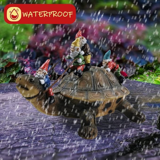 Resin turtle yard statue with gnome figurines standing on the shell