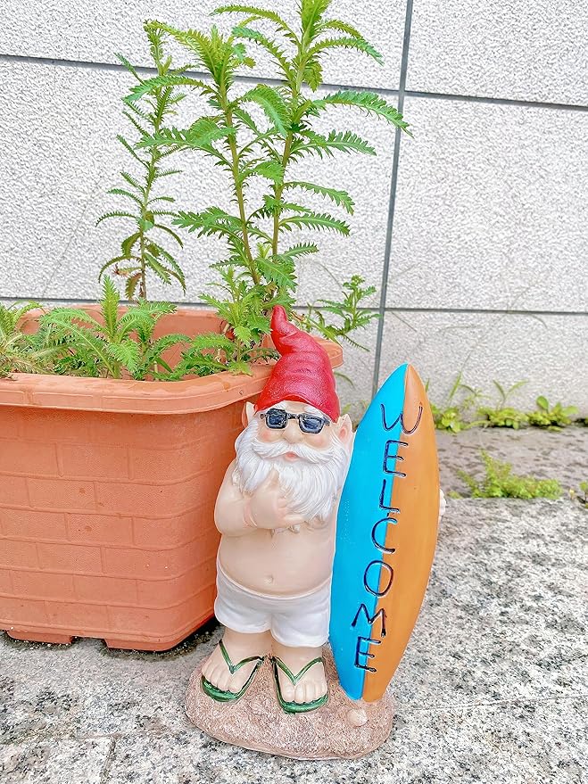 Garden gnome statue with surfboard, red hat, blue sunglasses, sandals and green straps