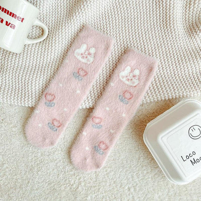 Pink and white bunny motif crew socks with striped toes and embroidered bow accents