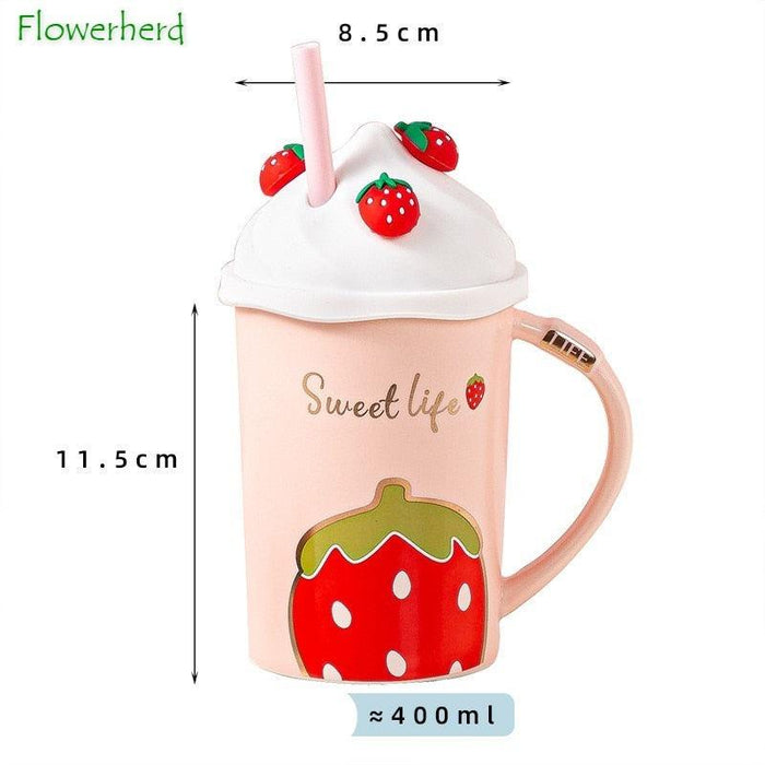Pink strawberry mug with white lid, straw, and side handle, front fruit decal