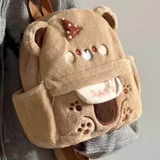 Plush bear backpack showing plush face, polka-dot bow, and front pocket