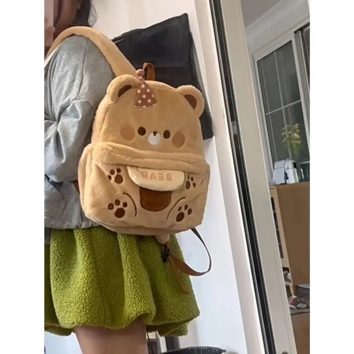 Plush bear backpack light tan with front pouch, paw prints, and adjustable strap