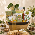Gourmet gift basket with tan basket, green bow, assorted snack and cheese packages