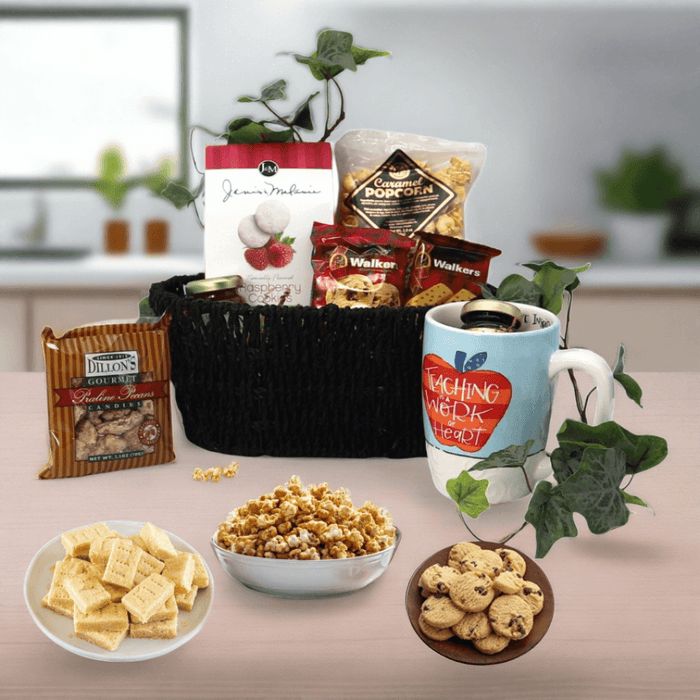 Teacher appreciation gift basket with black woven basket, snacks, and mugs