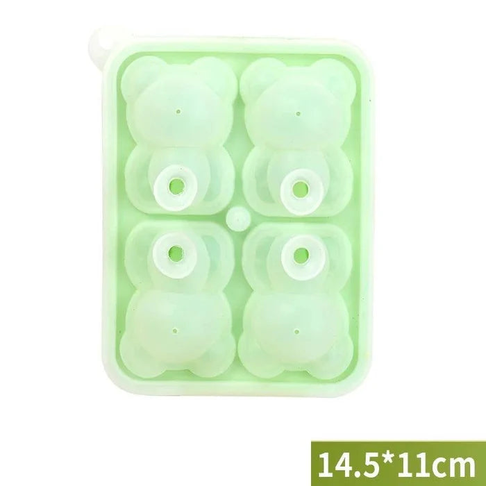 Green teddy bear ice mold with four bear-shaped cavities and small release holes