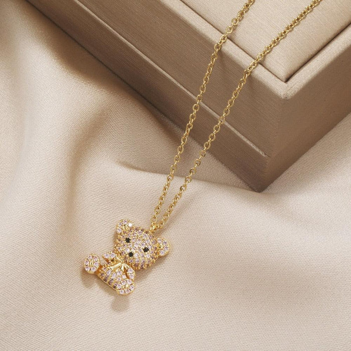 Gold-tone teddy bear pendant necklace with detailed sparkling bear charm