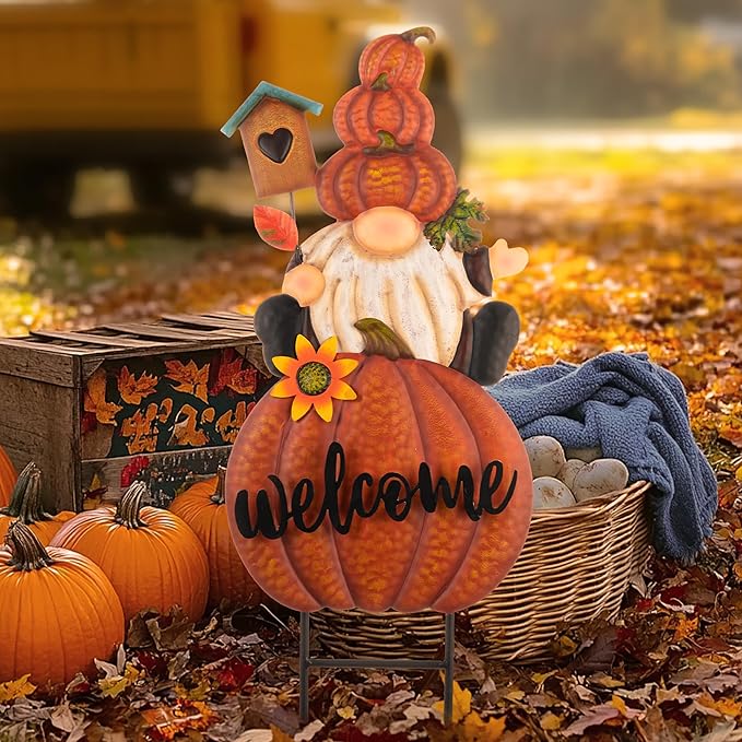 Orange pumpkin welcome gnome yard sign with sunflower, teal house, and metal stake stand.