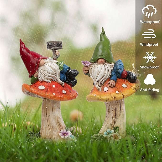 Resin garden gnome statues set of 2 in grass with rain-like droplets, red and green hats