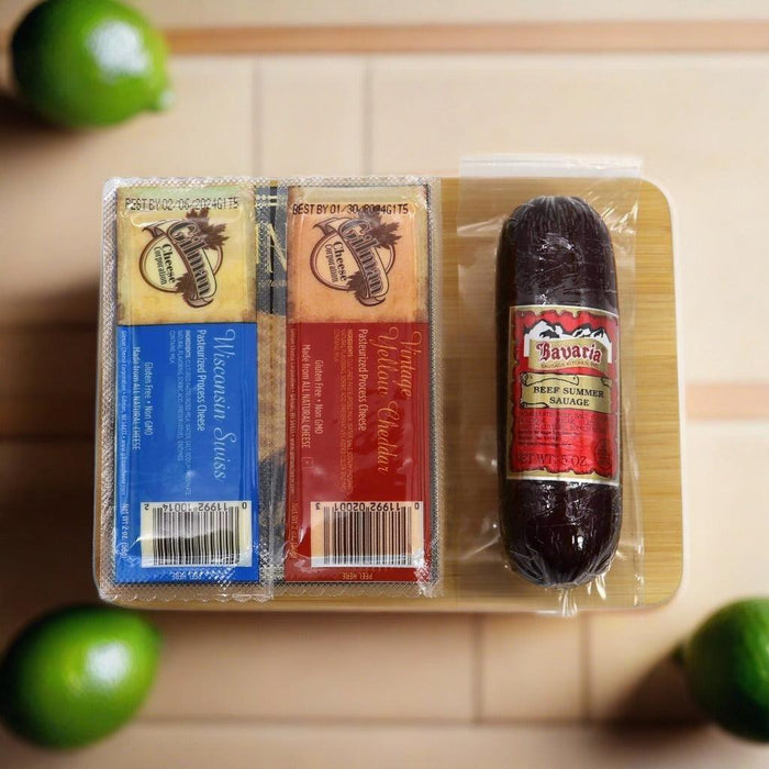 Charcuterie board gift set with packaged cheeses and Bavarian sausage links
