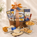 Assorted gourmet gift basket with crackers, brie, nuts, and dip in a burlap tote