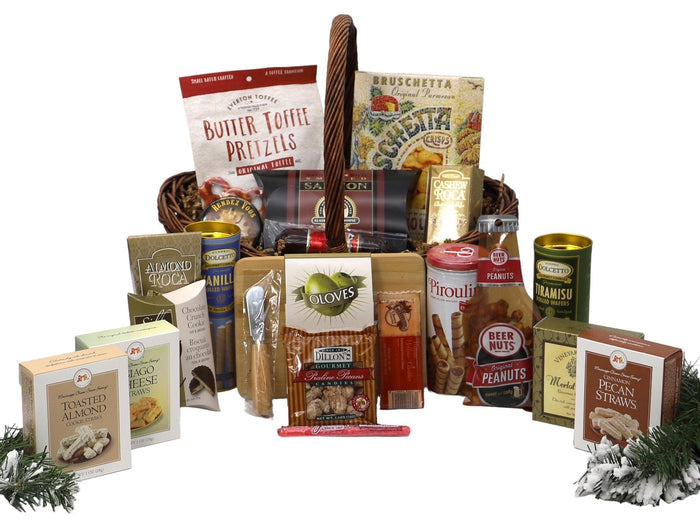 Wicker Christmas gift basket with wrapped treats, nuts, cookies, and small candy tins