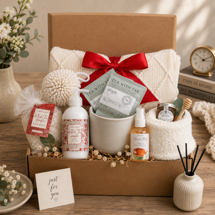 Gift box with red satin bow, bath set items and note card