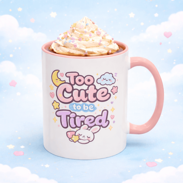 Pink and white kawaii bunny mug with "Too Cute to be Tired" graphic and pink handle