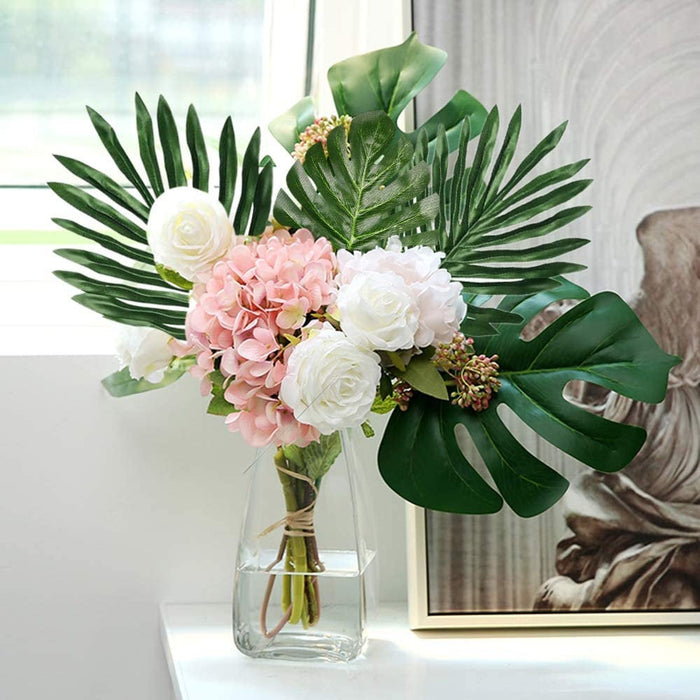 Tropical leaf stems with large green leaves in a bouquet centerpiece