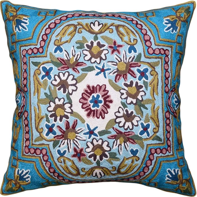 Turquoise floral embroidered pillow cover with central medallion and colorful Suzani motifs