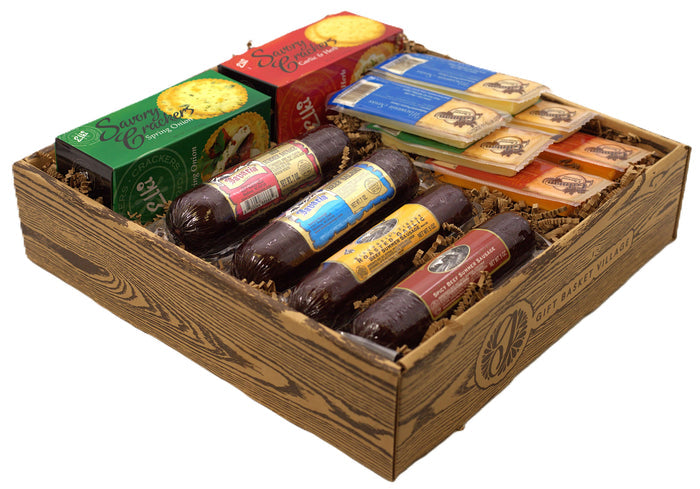 Wooden charcuterie gift crate with assorted sausages, crackers, and snack packs