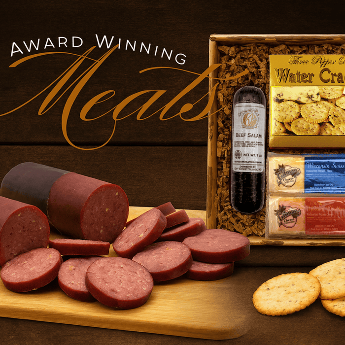 Salami slices with cheese crackers and a gift box of cured meats and cheese