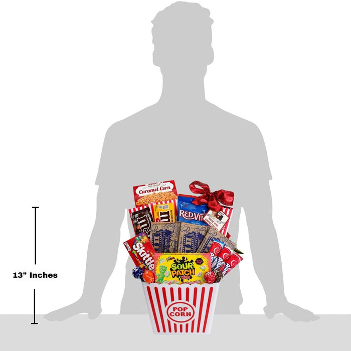 13-inch movie night gift basket with popcorn bucket and assorted candy, held by silhouette