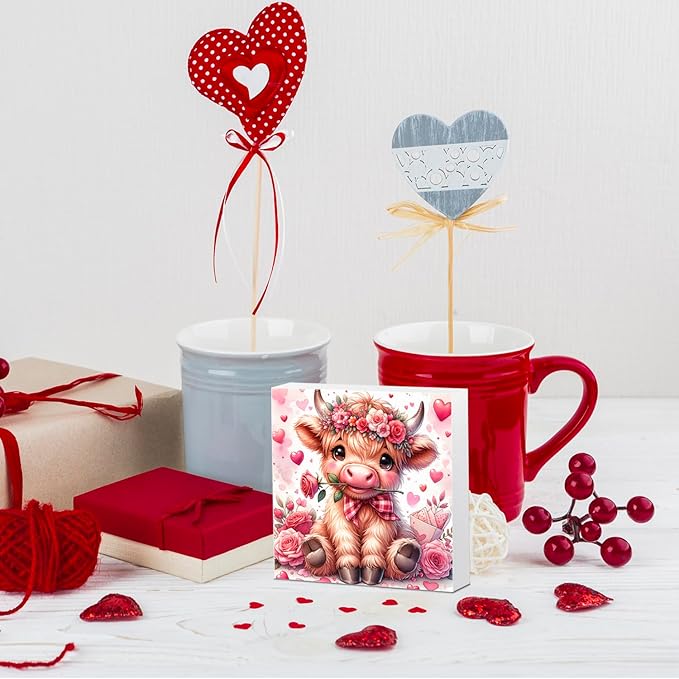 Valentine's wooden decor sign featuring a Highland cow with roses and heart details