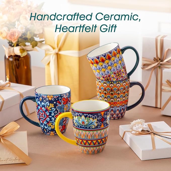 Handcrafted ceramic gift set of boho coffee mugs with handles, colorful patterns on display